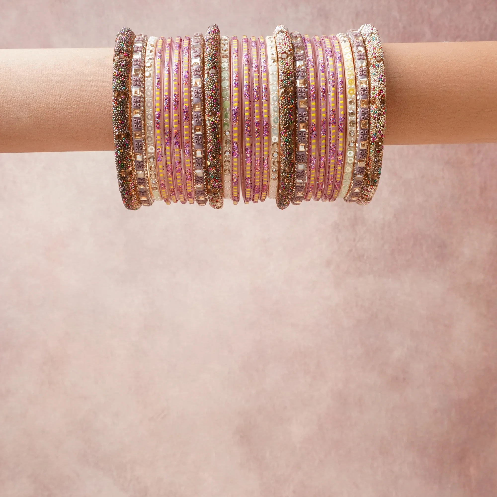 A grounding Soft Lavender forms the heart of the set, while touches of Gold, Ruby Red, Amethyst Purple, White Micro-Beads, Emerald Green Micro-Beads add charm.

A thoughtful composition of Glass, Acrylic, Metal Alloy, Glass Seed Beads, Crystal Rhinestone, Glitter, designed to feel complete without being heavy.
Each element layers seamlessly, creating a look that is refined, wearable and quietly striking.